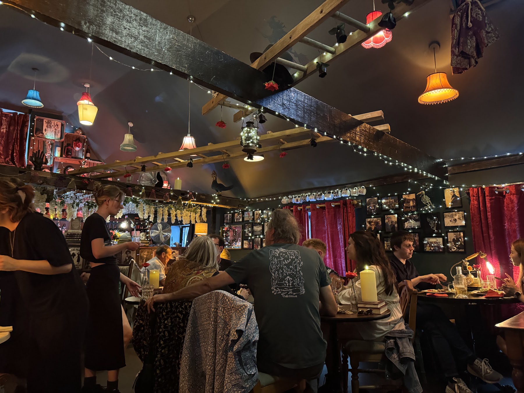 Mismatched pendant lamps and dark velvet curtains inside ThewitchEZ